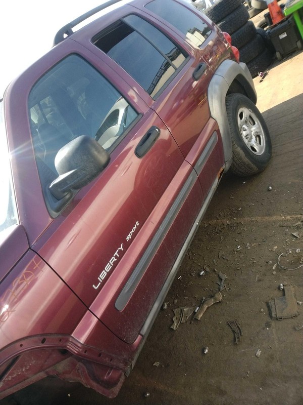 Used Front Left Door Assembly Front fits: 2003 Jeep Liberty L. manual window reg