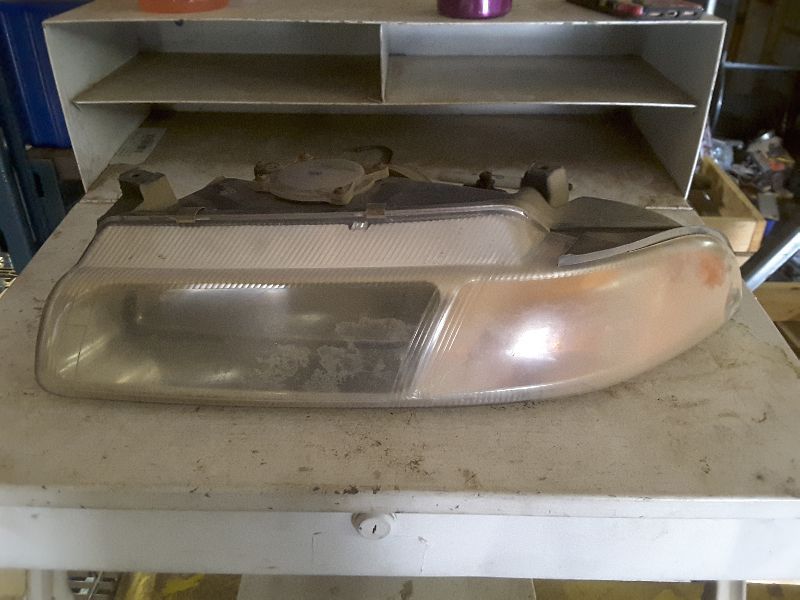 95 96 STRATUS L. HEADLIGHT 73928
