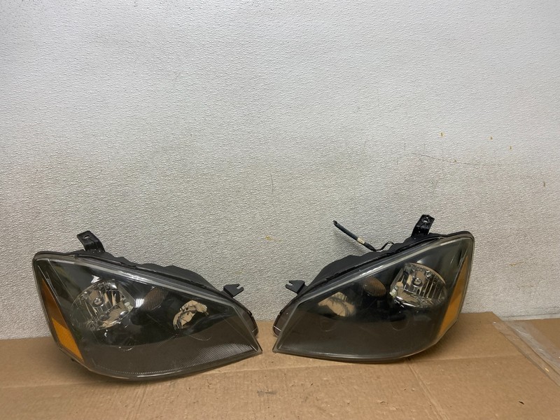 2002 to 2004 Nissan Altima Left+Right Side Set Halogen Headlights OEM Y8775 DW