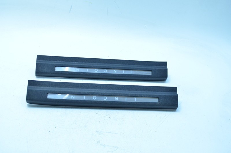 09-12 LINCOLN MKS FRONT RIGHT / LEFT DOOR SILL TRIM SET OEM
