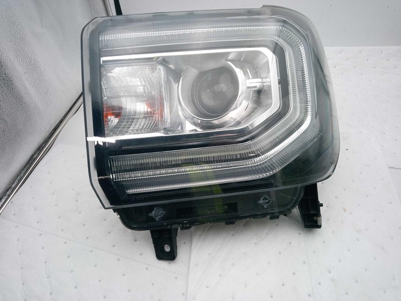 Used Left Headlight Assembly fits: 2016 Gmc Sierra 1500 pickup HID opt T4F Left
