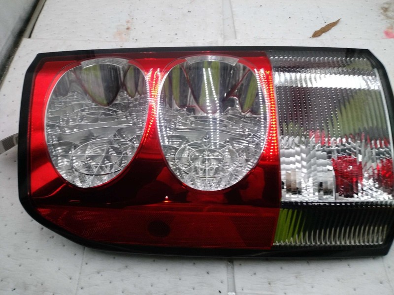 2010 Land Rover LR4 Left Tail Light Assembly White 282767 OEM Replacement Used