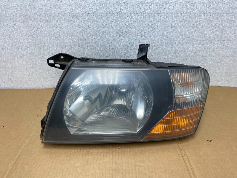2000 to 2004 Mitsubishi Montero Pajero Left Driver LHHeadlight AC7499 DW