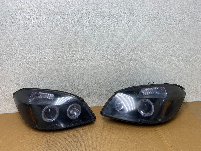 2005 - 2010 Chevrolet Cobalt Sedan Left+Right Headlights AE1408 DG