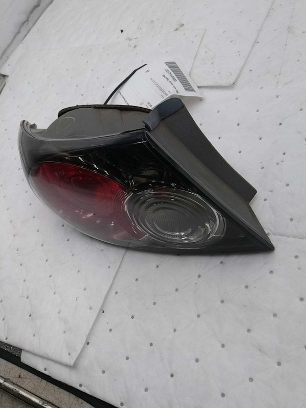 Used Left Tail Light Assembly fits: 2006 Mazda 6 Htbk 5 Dr lid mounted black bac