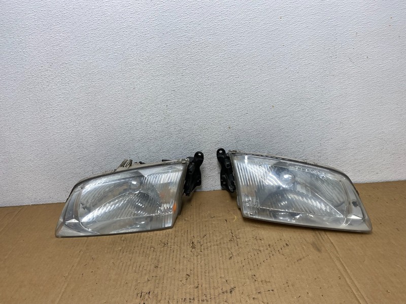 2000 to 2002 Mazda 626 Left+Right Side Headlights Oem AD1087 DW