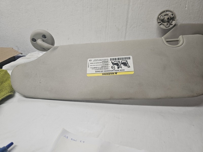 Pair Sunvisors Fits: 2014 Dodge Caravan w/o illumination Left Stained