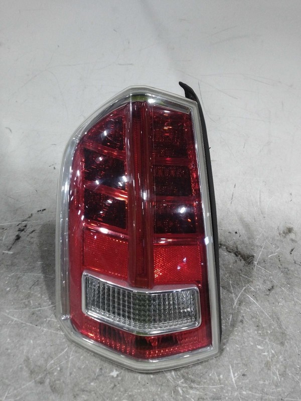 Used Left Tail Light Assembly fits: 2013 Chrysler 300 w/rear fog lamps w/smoked