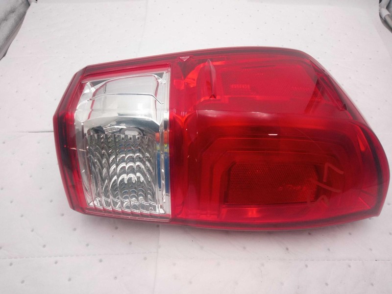 Used Left Tail Light Assembly fits: 2017 Toyota Tacoma w/o bezel trim clear lens