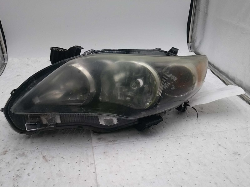 Used Left Headlight Assembly fits: 2013 Toyota Corolla L. w/black trim Left Grad