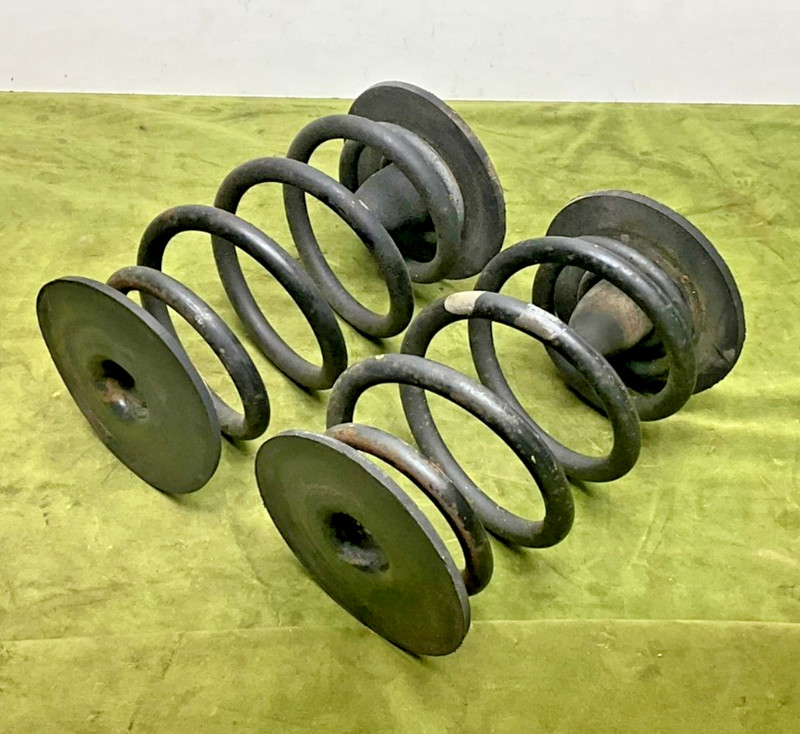 84-87 BMW E30 325e Coupe Sedan Factory Rear Axle Coil Barrel Spring Pair Pad OEM