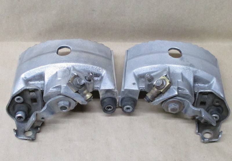 USED 1984-1987 PONTIAC FIERO REAR BRAKE CALIPER SET - LEFT AND RIGHT SIDE