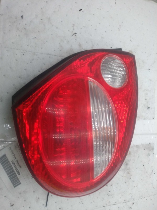 Used Left Tail Light Assembly fits: 2000 Nissan Maxima quarter panel mounted L.