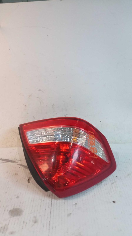 Used Left Tail Light Assembly fits: 2011 Nissan Versa quarter panel mounted Sdn
