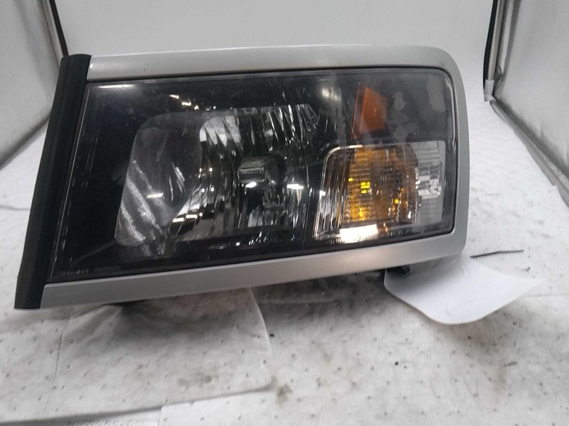 Used Left Headlight Assembly fits: 2010 Dodge Dakota chrome bezel with chrome tr