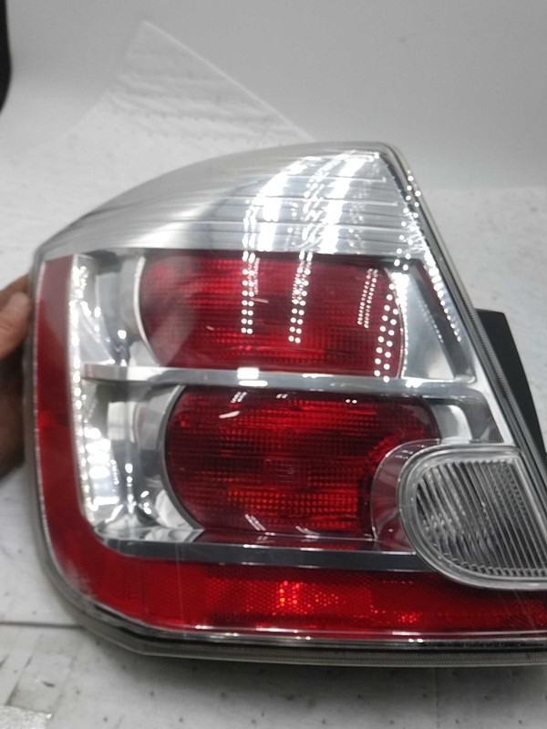 Used Left Tail Light Assembly fits: 2010 Nissan Sentra quarter mounted 2.0L exc.