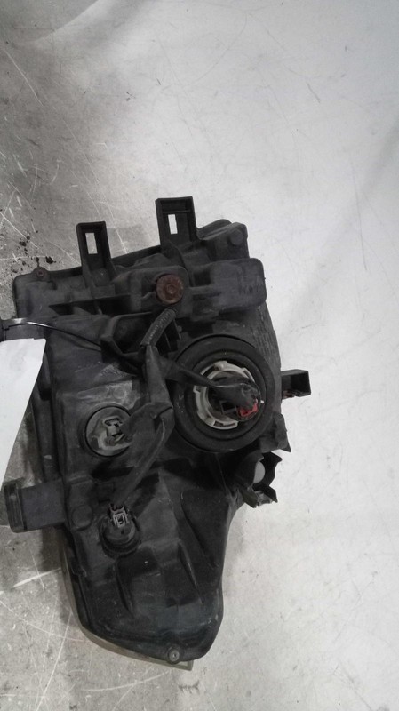 Used Left Headlight Assembly fits: 2005 Nissan Frontier Left Grade B