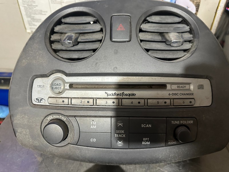 06-08 ECLIPSE OEM ROCKFORD FOSGATE RADIO CD PLAYER CONTROL PANEL W VENT TRIM