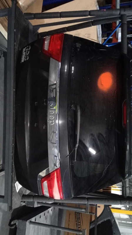 Used Deck Lid fits: 2012 Jeep Grand cherokee exc. SRT8 w/rear view camera Grade