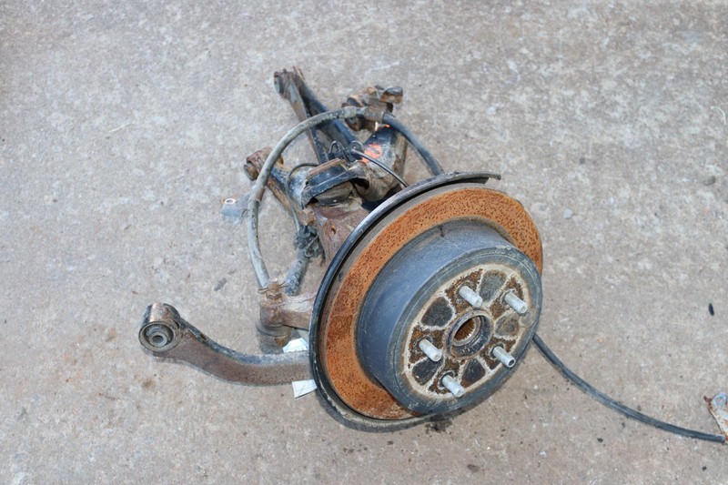 2015-2021 SUBARU WRX AWD REAR LEFT SPINDLE KNUCKLE HUB W/ CONTROL ARMS OEM