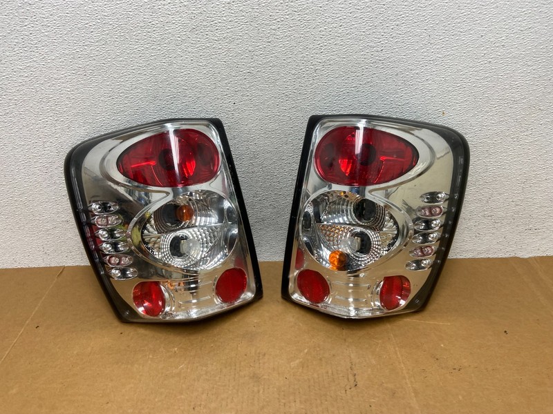1999-2004 Jeep Grand Cherokee Left + Right Set Chrome Tail Lights AD8971 DG
