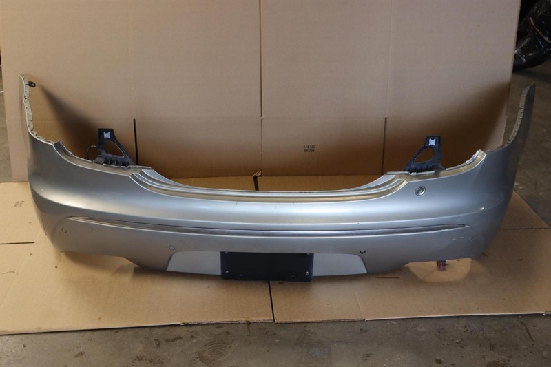 2010-2015 JAGUAR XJ REAR BUMPER COVER W/ PARKING SENSORS OEM