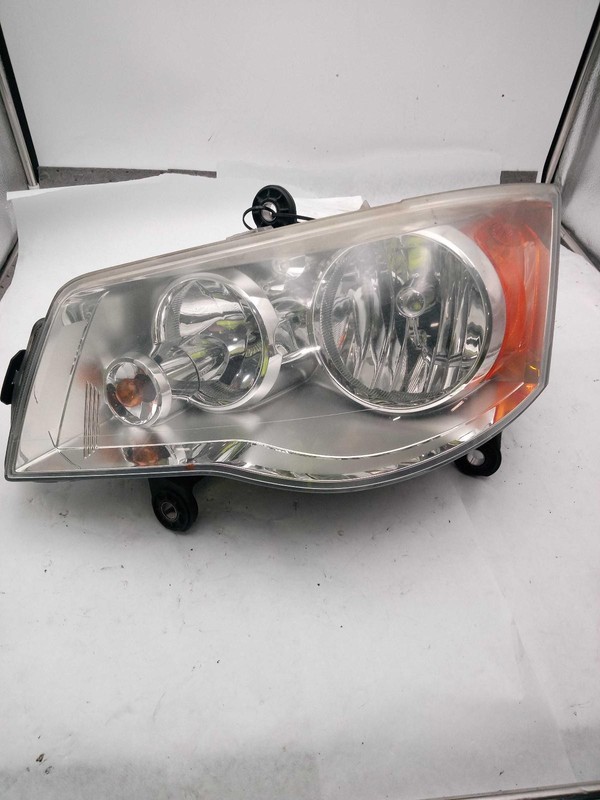 Used Right Headlight Assembly fits: 2010 Chrysler Town & country exc. automatic