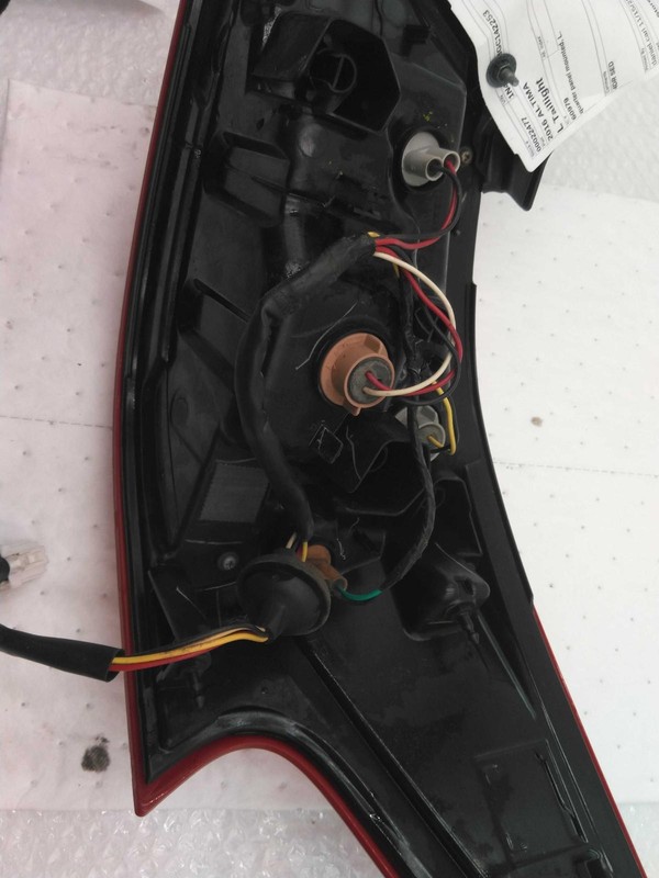 2016 Nissan Altima Left Tail Light Assembly Black - Used, Scuffs on Lens