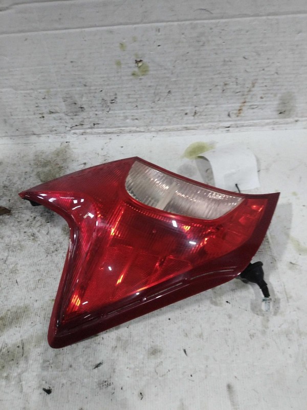 2016 Nissan Versa Left Tail Light Assembly Silver 394418 Used 125K Miles