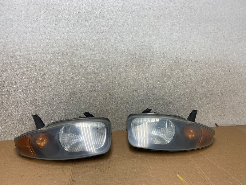 2003 - 2005 Chevrolet Cavalier Right+Left Black Headlight AA1441 PS