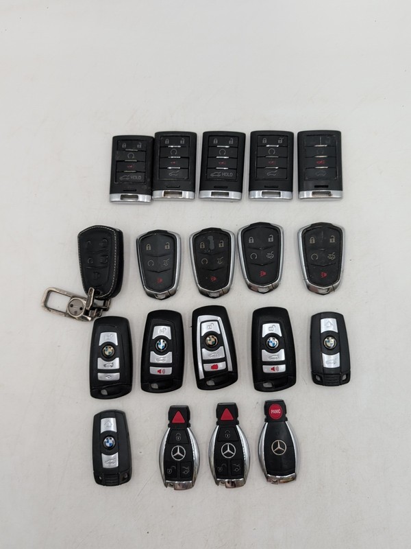 Lot Of 19 - (10) Cadillac Smart Key Fob Remote / (6) BMW Key Fob/(3) Mercedes
