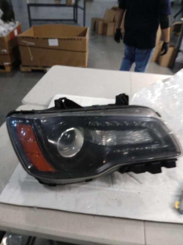 Used Right Headlight Assembly fits: 2014 Chrysler 300 black bezel halogen Right