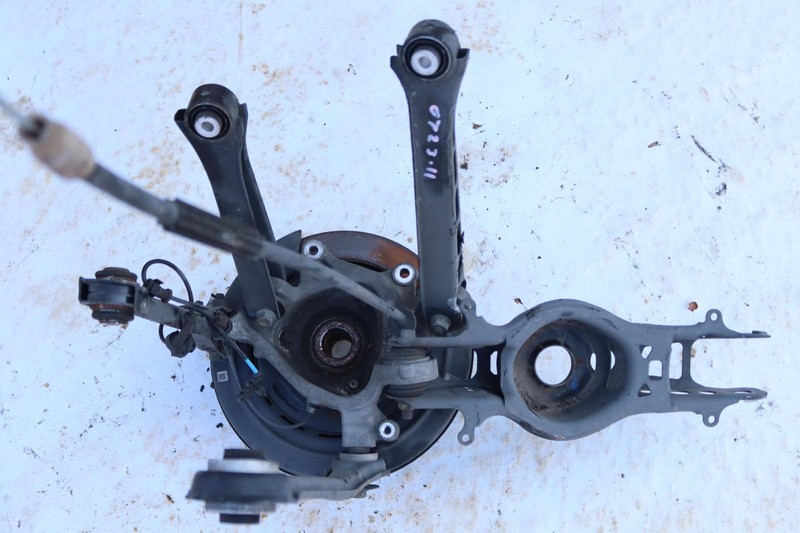 2014-2018 CADILLAC ATS SEDAN REAR LEFT SPINDLE KNUCKLE HUB W/ CONTROL ARMS OEM