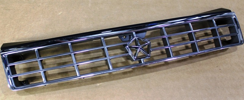 89-94 Plymouth Sundance Front Grille 4451502 NOS OEM