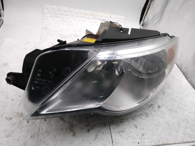 2009 Volkswagen CC Left Headlight Assembly Silver Used with Stress Cracks
