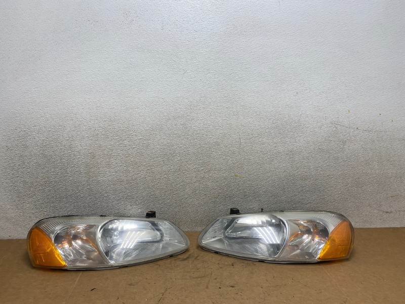 2001 to 2002 Chrysler Sebring Left+Right Side Headlights Oem X4860 DW
