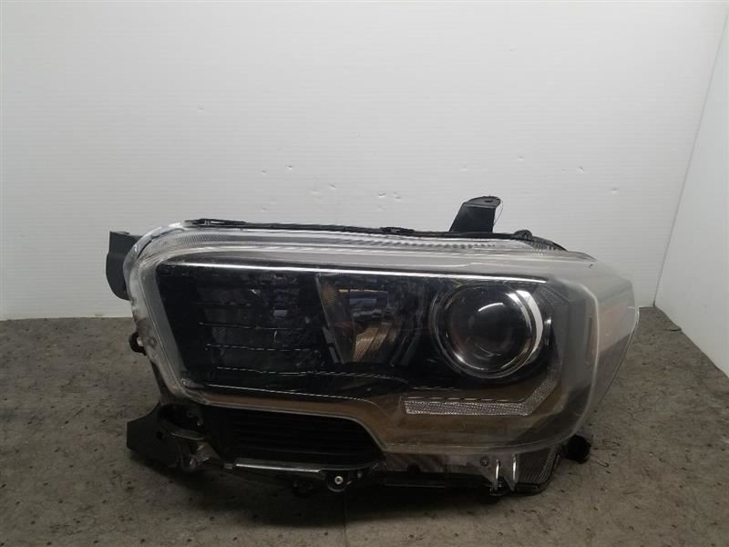 2017-2019 TACOMA Driver Side Headlight 1067646 Parts only. Broken tabs.