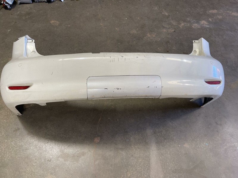 2011-2013 INFINITI QX56 REAR BUMPER COVER PANEL PLASTIC ASSEMBLY W/ SENSOR OEM
