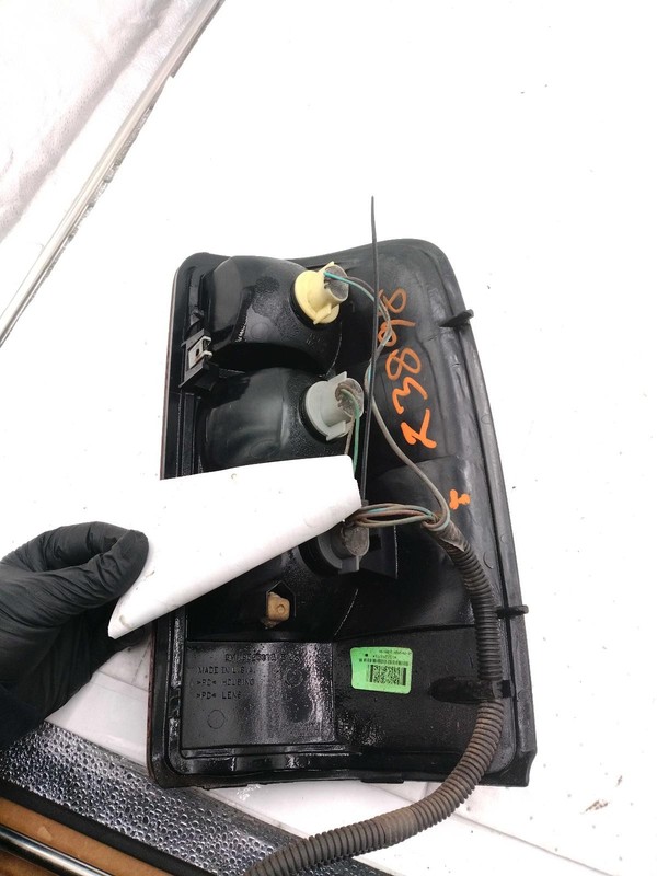 2006 GMC Yukon XL 1500 Left Tail Light Assembly Black OEM 433147 Used