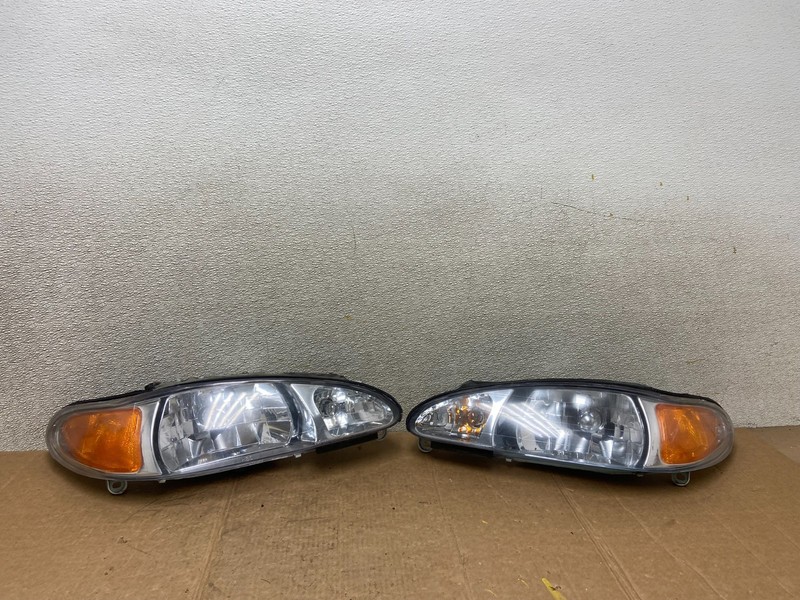 1998 to 2003 Ford Escort Left+Right Set Halogen Headlight Aftermarket AA1630 DG