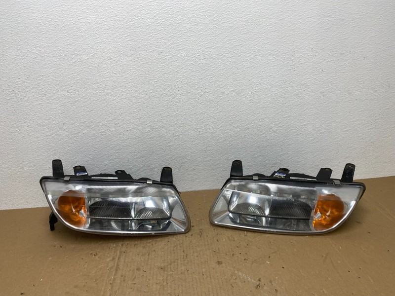 2000 to 2002 Saturn L Series Left+Right Set Halogen Headlights TYC AB6965 DW