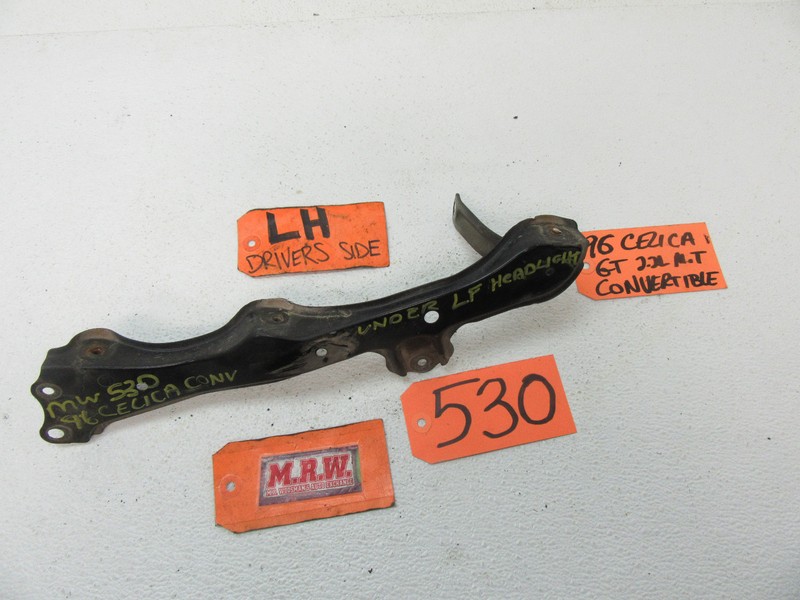 CELICA LEFT DRIVER HEADLIGHT BRACKET FRAME MOUNT RADIATOR SUPPORT BUMPER COVER