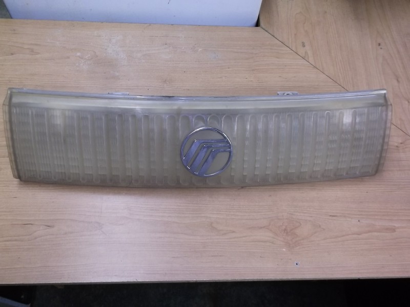 Mercury Cougar E94R-13A284-AC Center Headlight Lamp Assembly w/ Emblem