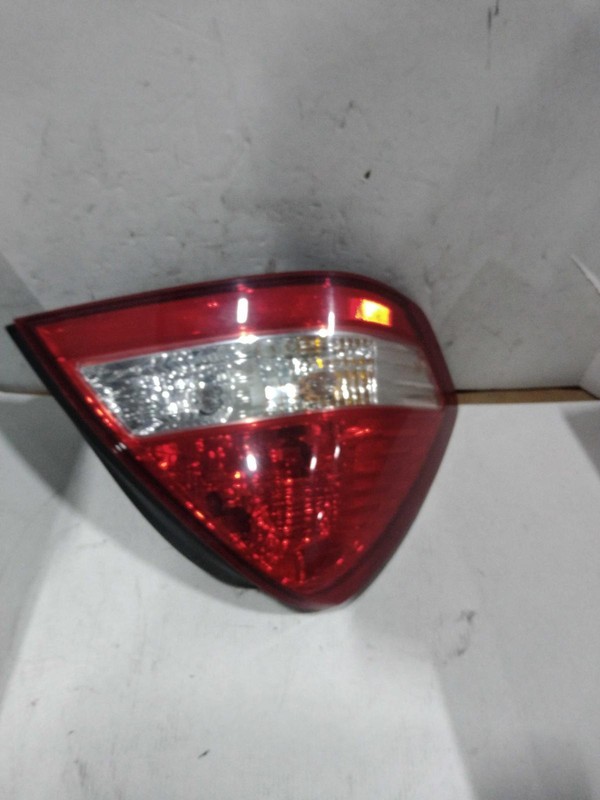 2007 Nissan Versa Left Tail Light Assembly Tan Aftermarket 553754 120K Miles