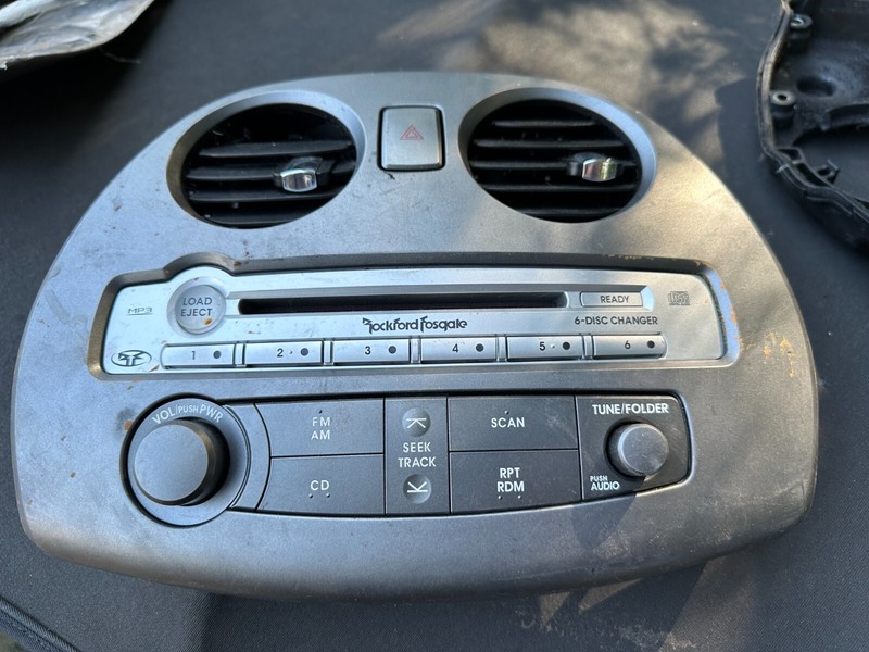 06-08 ECLIPSE OEM ROCKFORD FOSGATE RADIO CD PLAYER CONTROL PANEL W/ VENT TRIM