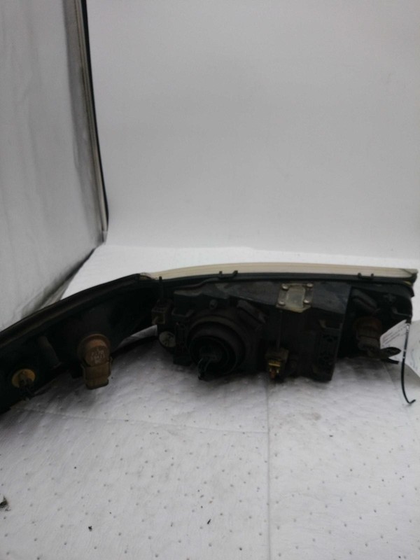 Used Left Headlight Assembly fits: 2000 Lincoln & TOWN CAR Left Grade C
