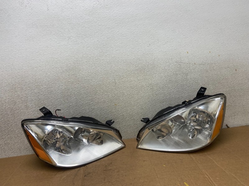 2002 to 2004 Nissan Altima Left+Right Side Set Halogen Headlights OEM AA1318 DW
