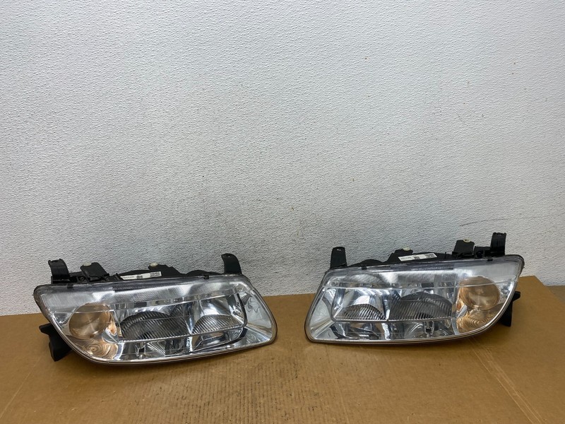 2000 to 2002 Saturn L Series Headlights Left+Right Side AD9266 DW