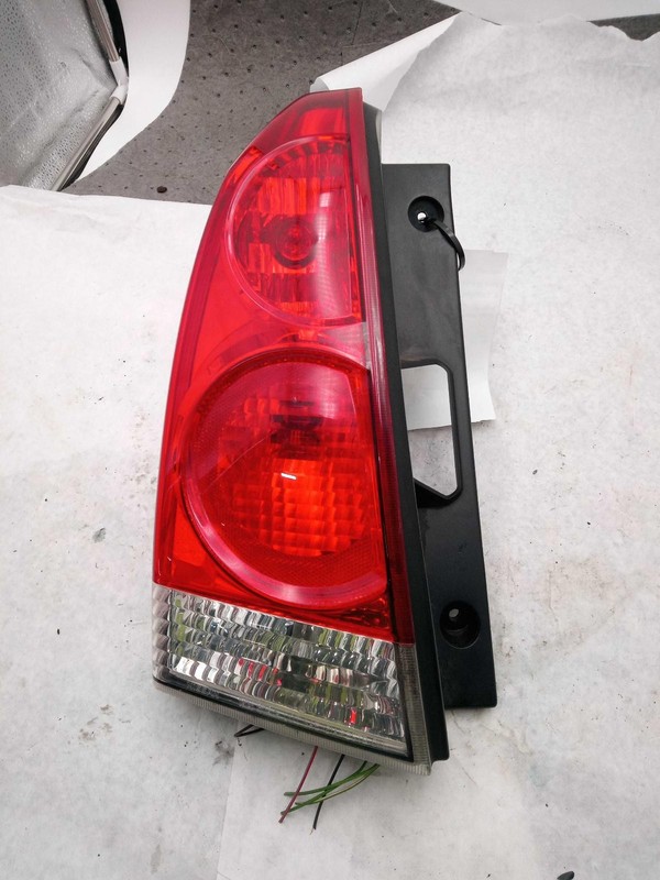 Used Left Tail Light Assembly fits: 2008 Nissan Quest quarter panel mounted red