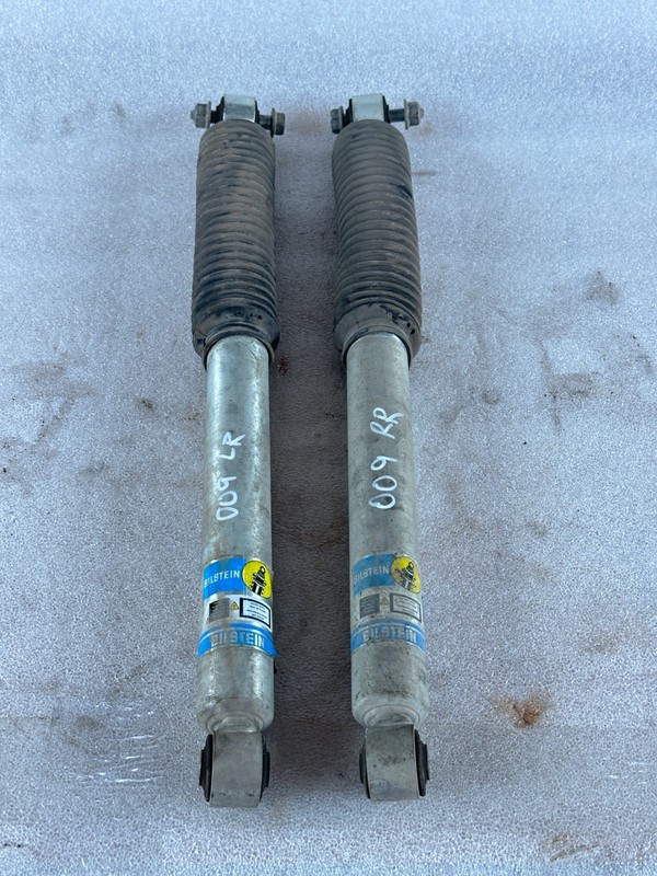 2012 DODGE RAM 2500 RAIR OF REAR SHOCK ABSORBERS, (UPLIFTED SUSPENSION)